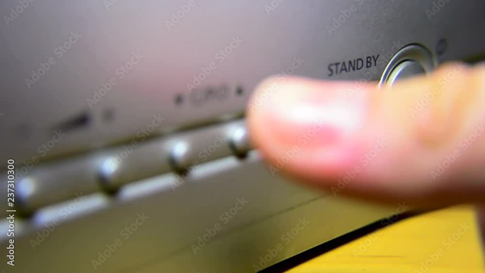 Turn on the old TV on the button. Turn on a old TV with finger and ...