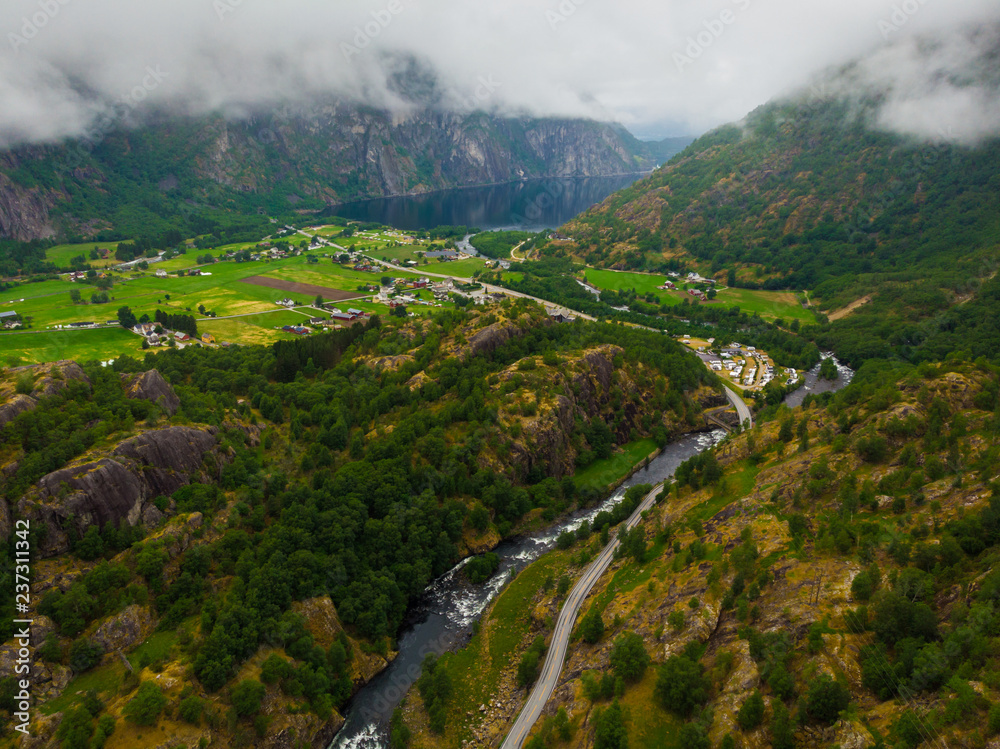 Naklejka premium Road and river in green mountains, Norway