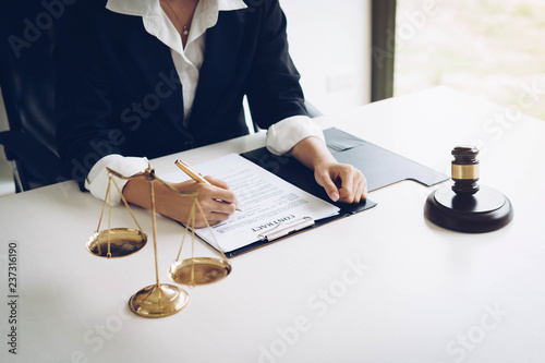 Professional female lawyers working at the law firms. Judge gavel with scales of justice. Legal law, lawyer, advice and justice concept.