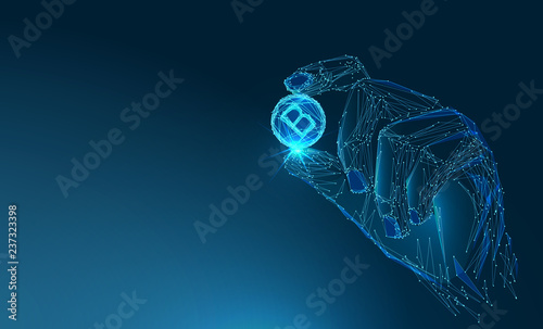 Bitcoin. Coin in the hand. Coin in the hand.Тechnological concept. Banner. Low poly vector illustration of a starry sky or Cosmos. photo
