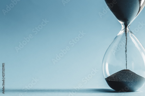 Hourglass on blue background