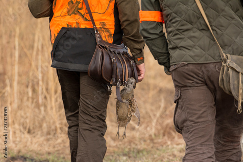 The hunter in the hunting clothes and with rifle hunts