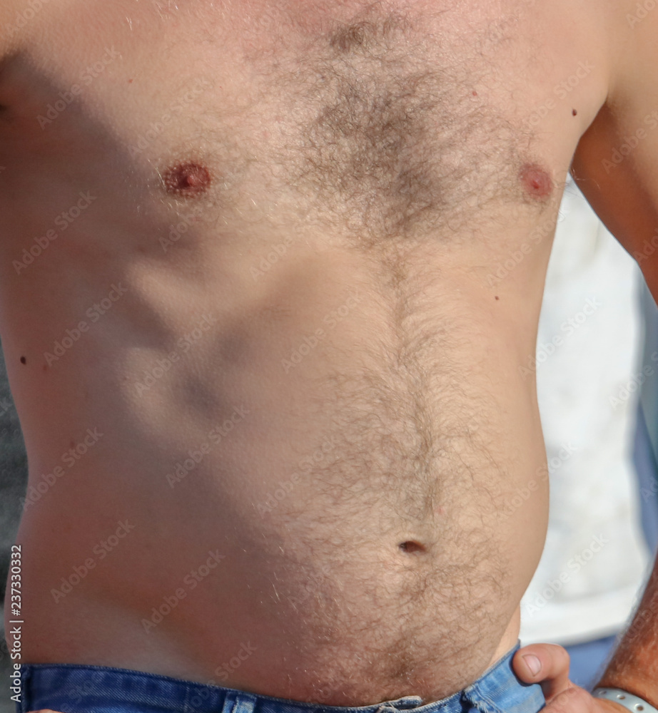 Naklejka premium A man with a hairy chest and stomach as background
