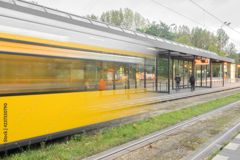 Fototapeta premium A yellow tram in motion