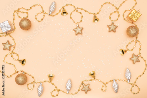 gift box or present box with golden star, bell and ball on golden background for birthday, christmas or wedding ceremony