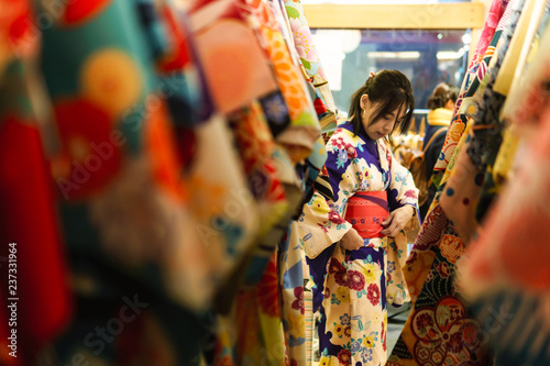Tablou canvas Young asian woman dress up with japanese kimono in kimono rental shop in japan