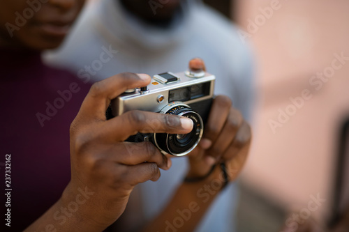 Woman using an analog film camera
