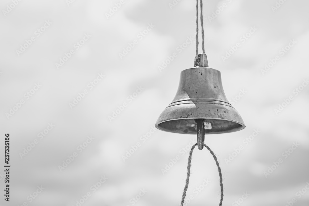 Fototapeta premium the bell hangs on a rope
