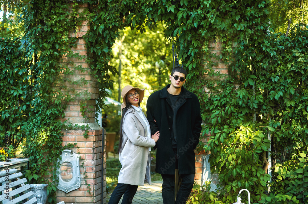 Fototapeta premium young couple in love on the streets of the autumn city . Young men in coats