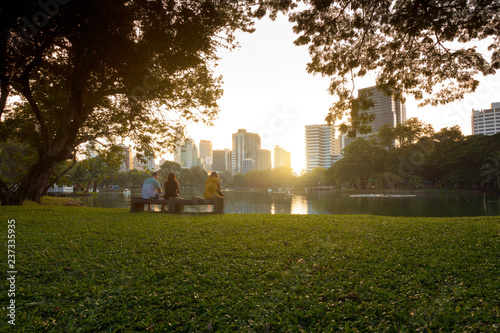 Photography Bangkok city beautiful skyline at dusk, viewing from Lumphini Park with tourist are traveling here