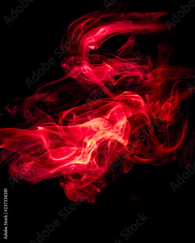 Red smoke on black background