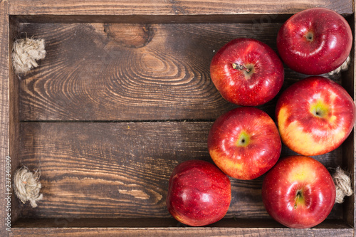 Sweet apples on wooden background