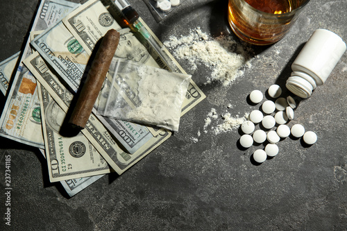 Quadro su tela Drugs, alcohol and money on grey background. Concept of addiction