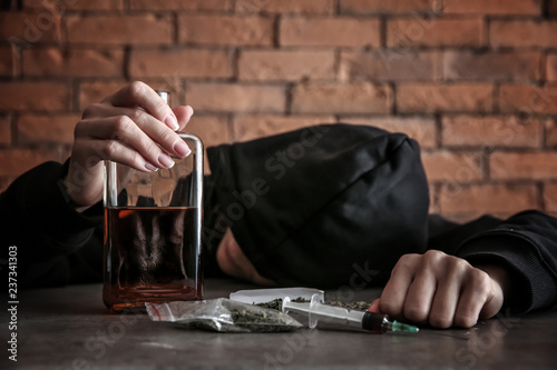 Female junkie with alcohol ...
