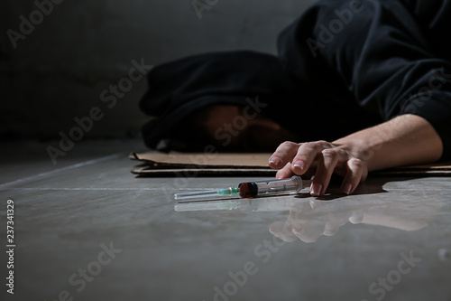 Female junkie lying on floo...