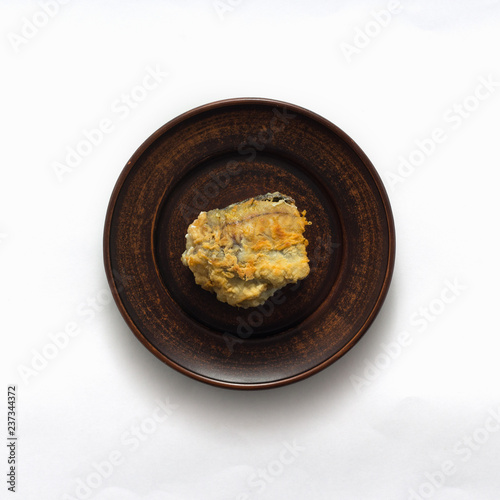 Delicious fried fish on white background, top view, flat lay