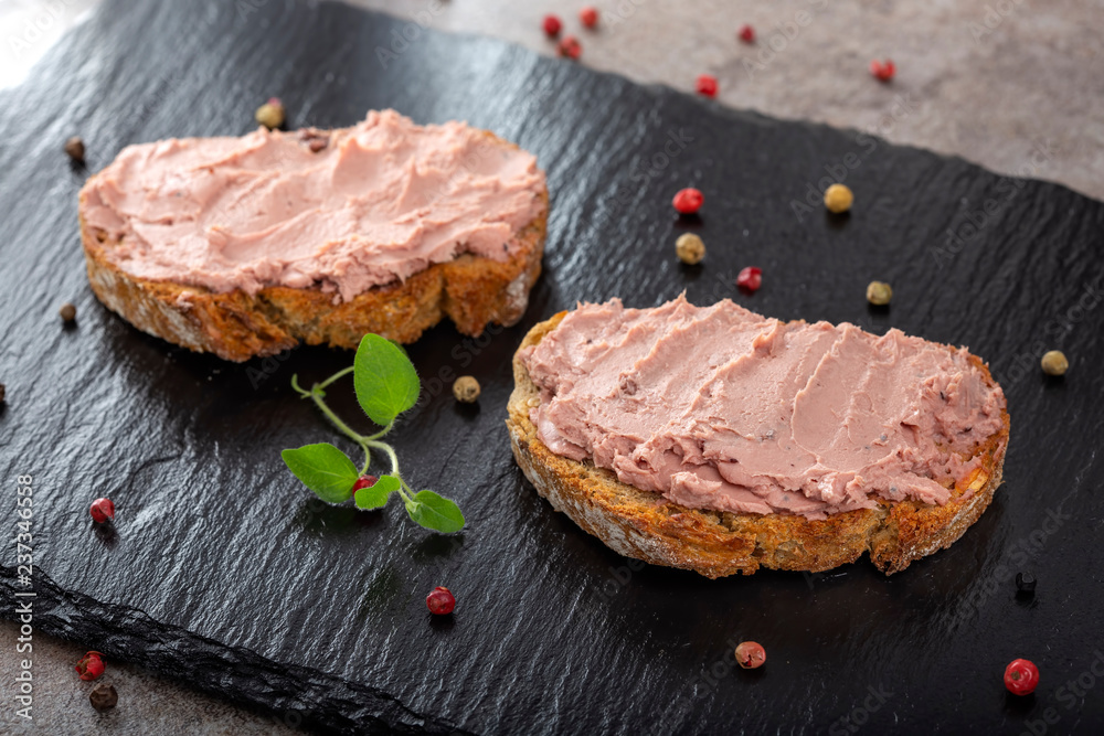 Open sandwiches with pate specialty made from pork and turkey liver with sweet cranberry jam