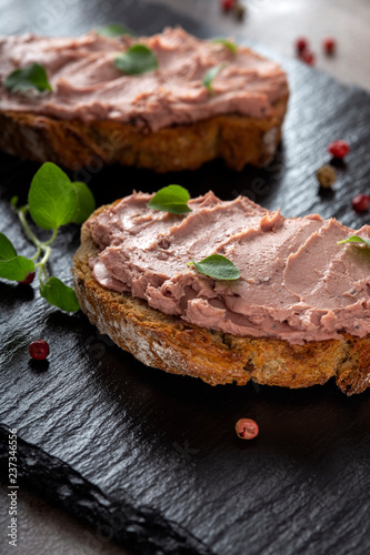 Open sandwiches with pate made from pork and turkey liver with sweet cranberry jam