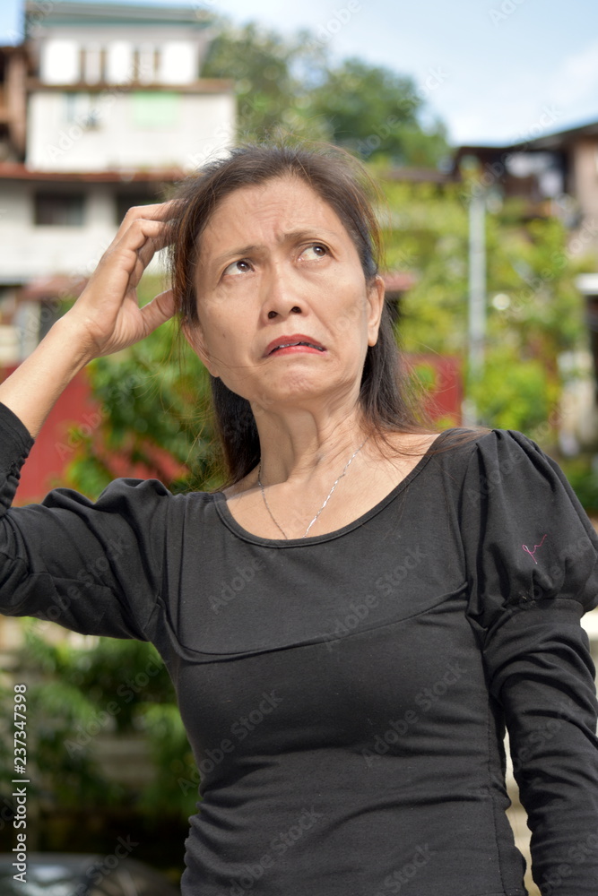 Filipina Female Senior With Alzheimers