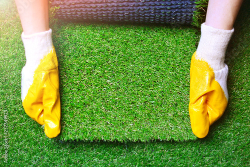 Fotografija Greenering with an artificial grass background