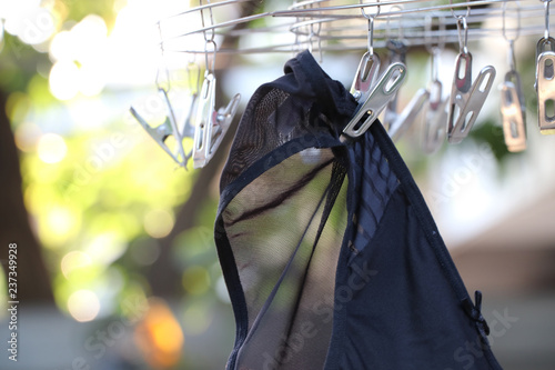 Underwear woman black color on stainless hanger with soft light in the morning day