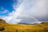 Beautiful mountain rainbow in Iceland. Colorful summer morning in Iceland, in Europe. Artistic style post processed photos.
