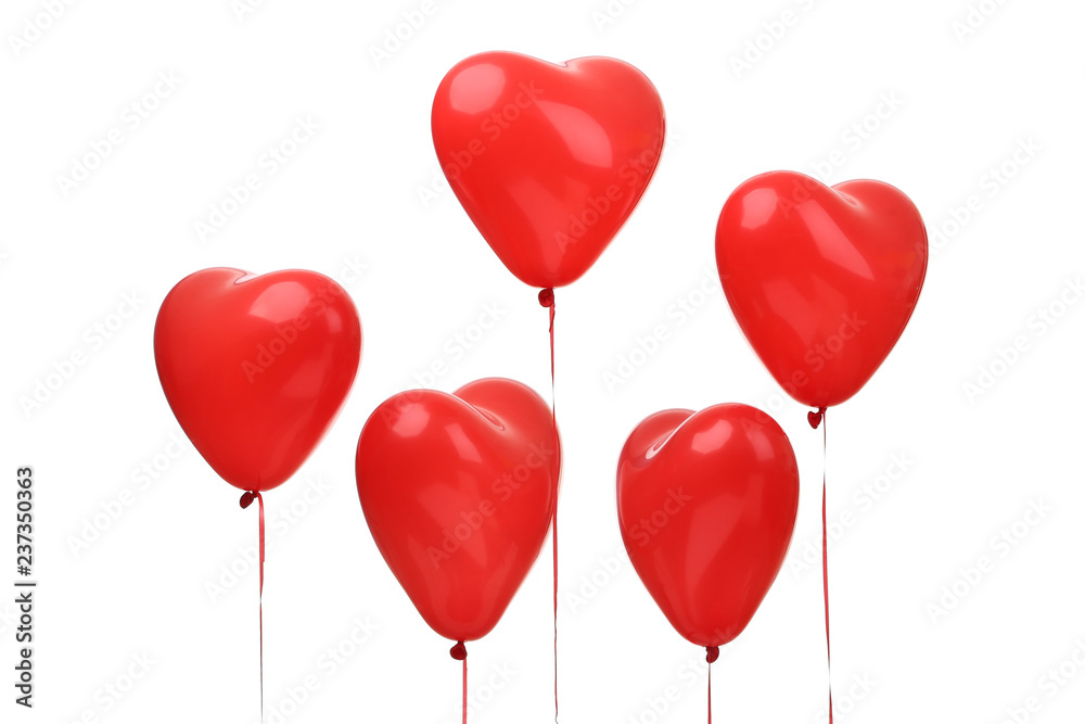 Red heart-shaped air balloons for Valentine's day on white background