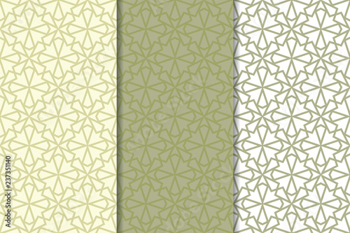 Olive green and white geometric ornaments. Set of seamless patterns