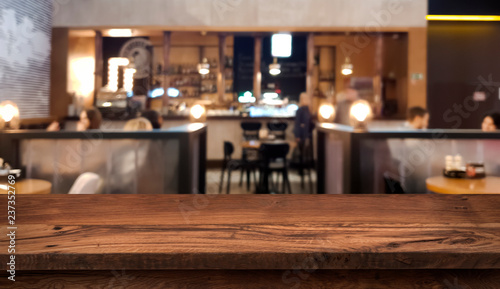 Table top counter with blurred people and restaurant interior background