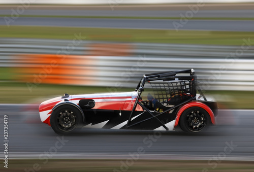 Race car racing on speed track © Alexey Kuznetsov