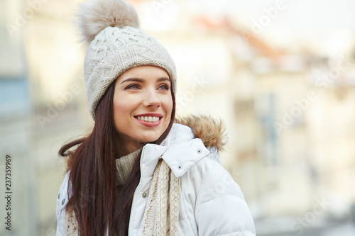 fashionable smiling woman in winter clothes
