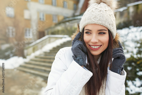 fashionable smiling woman in winter clothes