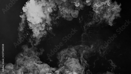 Fog and mist effect on black background. Smoke texture overlays.