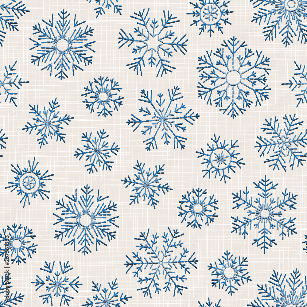 Seamless embroidery snowflakes background.