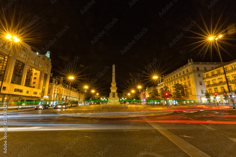 LISBON, PORTUGAL - AUGUST 4: The Monumento aos Restauradores on a summer night in Lisbon, Portugal on August 4, 2017. LISBON, PORTUGAL - AUGUST 4: The Monumento aos Restauradores on a summer night in Lisbon, Portugal on August 4, 2017.