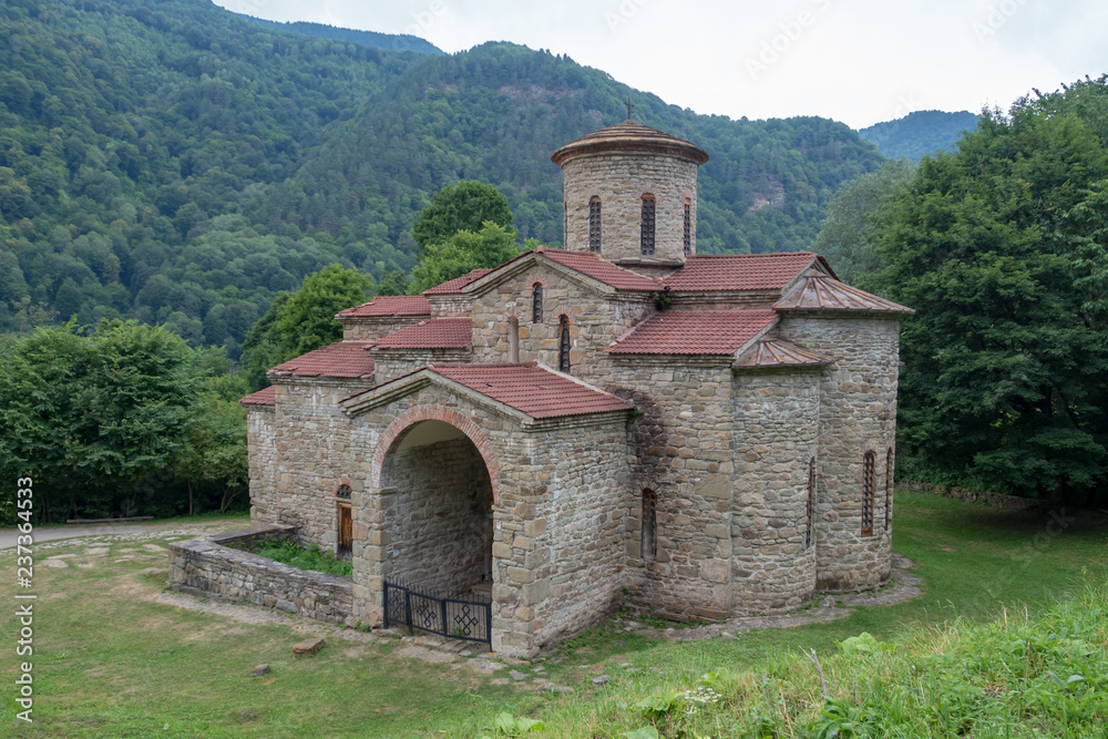 Fototapeta premium Northern temple.. Ancient Christian Church of Alanya in the Caucasus Mountains. Russia, Karachay-Cherkessia, Arkhyz.