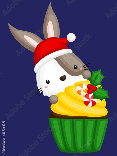 A vector of cute little frog behind a sweet christmas cupcake