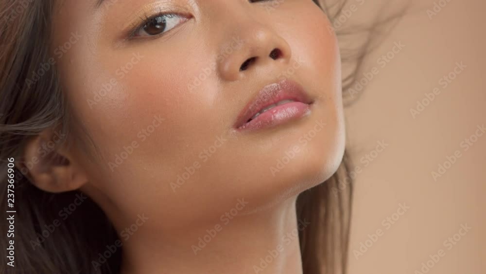 closeup thai asian model with ideal glowing strobing skin closeup thai asian model with ideal glowing strobing skin