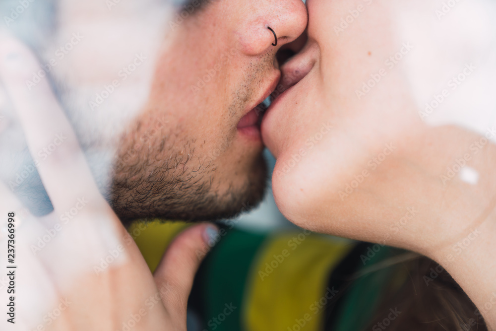 Crop couple kissing at home Crop couple kissing at home