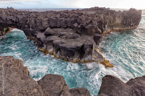 Volcanic Coastline near the Piscina Natural da Ponta da Ferraria. photo