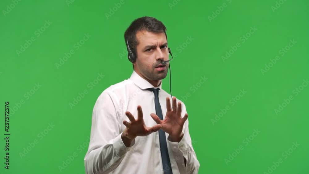 telemarketer man is a bit nervous and scared stretching hands to the front on green screen chroma key background telemarketer man is a bit nervous and scared stretching hands to the front on green screen chroma key background