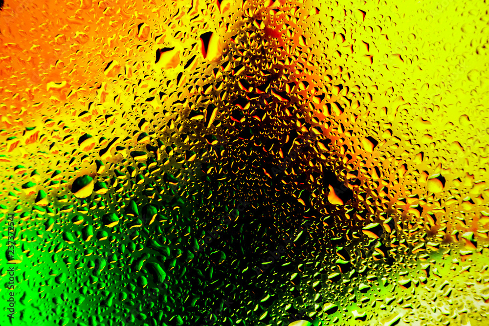 abstract waterdrops on the glass surfase with bright abstract waterdrops on the glass surfase with bright
