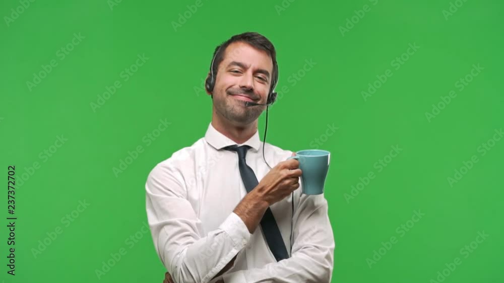 telemarketer man holding hot coffee on green screen chroma key background telemarketer man holding hot coffee on green screen chroma key background