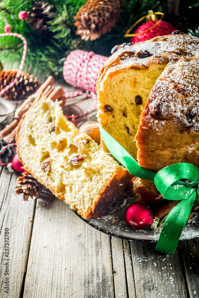 Εκτύπωση καμβά Traditional Christmas panettone with dried fruits and nuts, on old wooden backgr