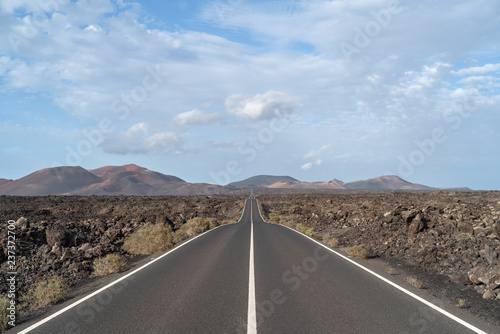 Road in the volcanic area Timanfaya National Park, Lanzarote, Spain