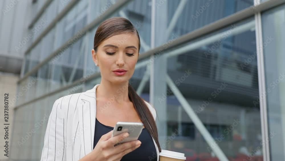 Business Woman With Phone And Coffee Going To Work Business Woman With Phone And Coffee Going To Work