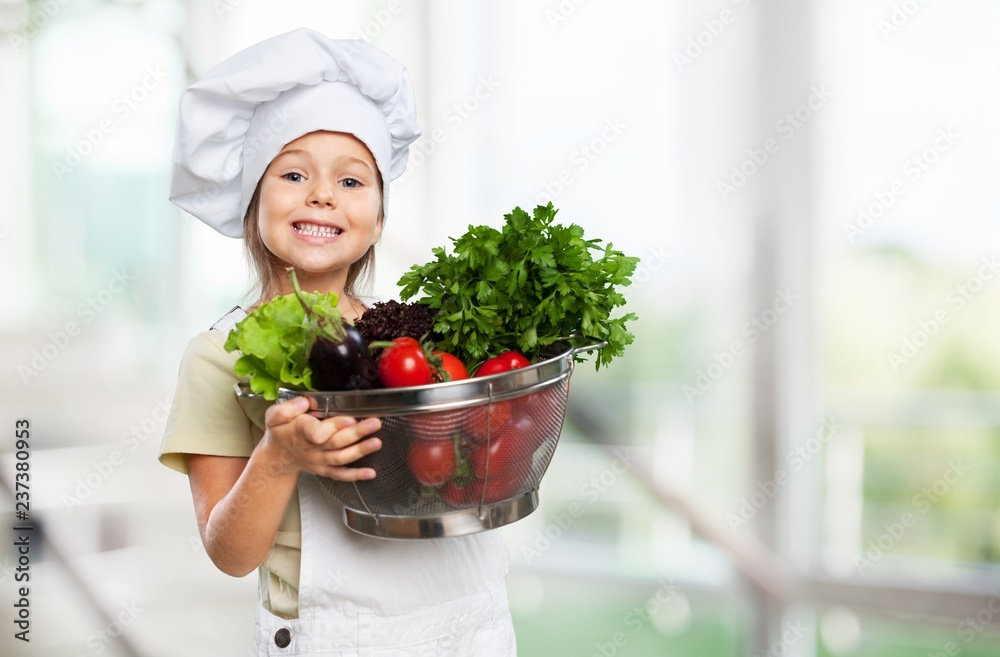 Portrait of adorable little girl preparing healthy food at Portrait of adorable little girl preparing healthy food at