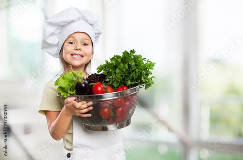 Portrait of adorable little girl preparing healthy food at