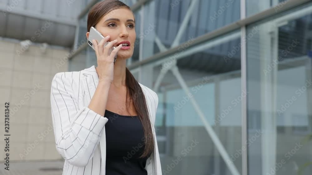 Beautiful Business Woman Talking On Phone Going To Work Beautiful Business Woman Talking On Phone Going To Work