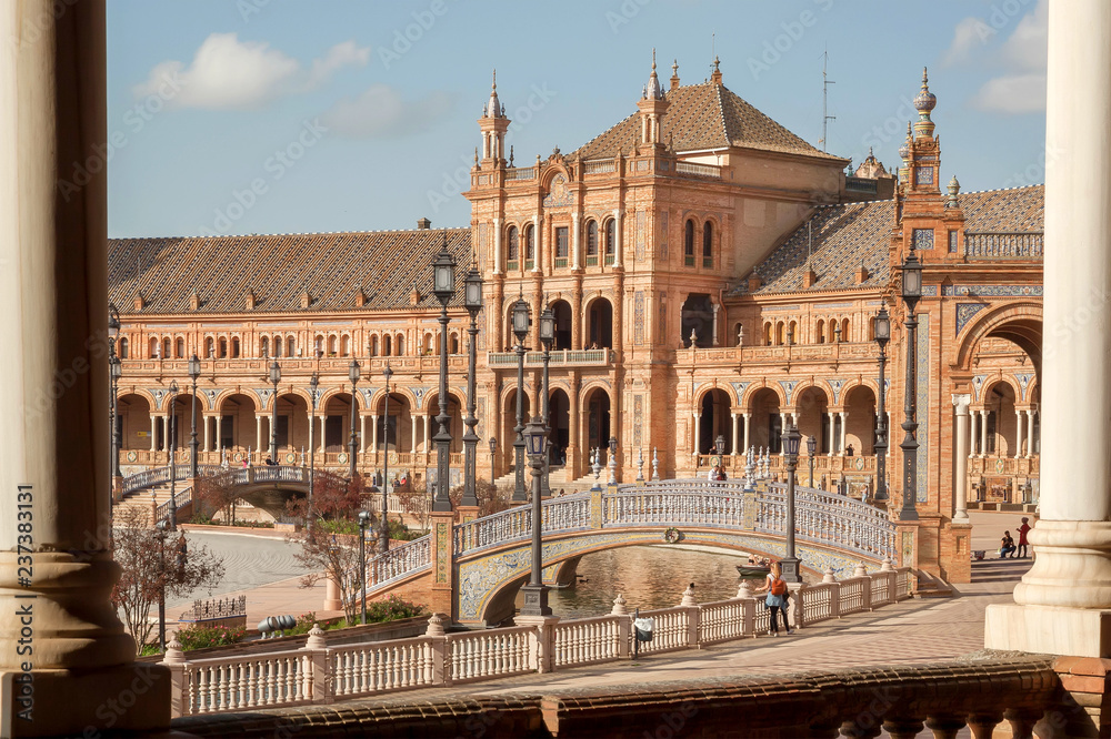 Great landmark with palace and stone bridge on Plaza de Espana, example of architecture of Andalusian city